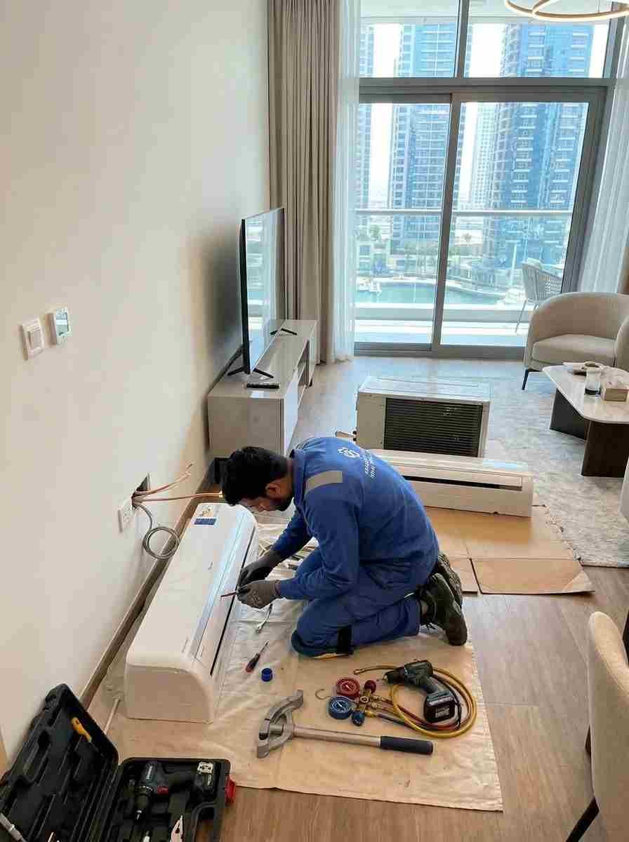 HVAC technicians installing a VRF air conditioning system in a luxury Arabian Ranches villa in Dubai