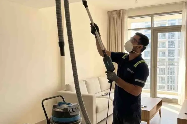 Professional HVAC Technician Cleaning AC Filter in Dubai